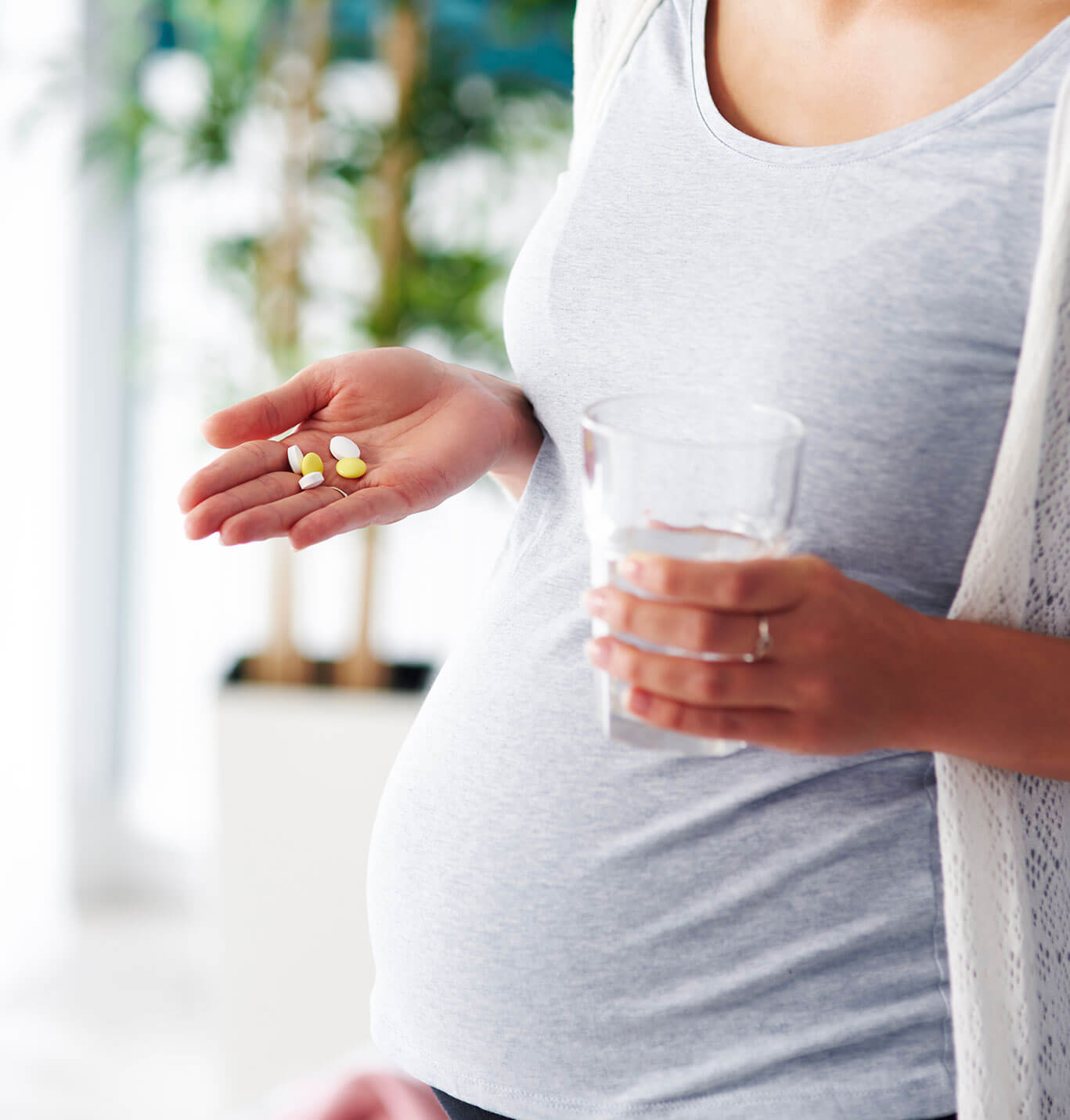 Pregnant woman taking Quatrefolic active folate supplements